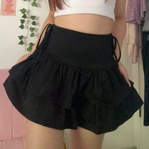 black ruffly lace up mini skirt